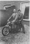 Two young Dutchmen pose on a motorcycle.

Pictured are Jan van den Berg (right), a Jehovah's Witness who was persecuted during the German occupation of the Netherlands, and Koos Lammers (left).
