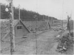 View of a row of barracks at the Kaufering IV concentration camp soon after the liberation.