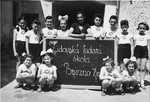 Students in the Jewish school of Brezno pose for a class picture in matching shirts with a Star of David.