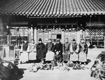 Chinese and Jewish workers pose outside  Paul Toper's fur export business.