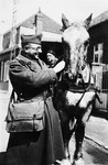A French Jewish soldier cares for his horse.

Pictured is Andre Samuel.