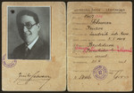 Interior pages of an identification card issued by the Ministry of the Interior to Izidor Schwarz stating that he is an office worker employed in the main office of the Jewish community.