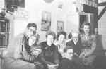 Group portrait of young people gathered in an apartment in Brussels.