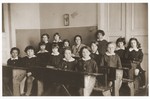 Students are seated at their desks in a classroom at the Chawatselet Jewish gymnasium for girls in Warsaw.