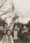 DP youth pose with a Zionist flag at the children's home in Blankenese, shortly before their departure for Palestine.
