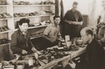 Cobblers make shoes in the Neu Freimann displaced persons camp.
