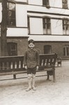 Six-year-old Heinz Stephan Lewy poses in the yard of the Baruch Auerbach Jewish orphanage in Berlin.