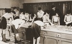 Boys living in the Baruch Auerbach Jewish orphanage in Berlin wash up in the communal washroom.