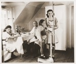 A young girl is weighed at a doctor's office in a sanatorium near Foehrenwald.