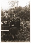 A Jewish mother and son pose outside in a park in Drohobycz, Poland.