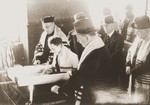 Ludwig Nachmann (center foreground), the president of the congregation, follows the Torah reading during a bar mitzvah at the liberal Zerrennerstrasse synagogue in Pforzheim.