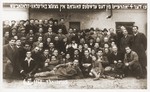 Group portrait of survivors from Borislov and Drohobycz, who have assembled at the Foehrenwald displaced persons camp to commemorate "the fourth anniversary of the first pogrom in the Borislov-Drohobycz ghetto."  

Among those pictured are Oskar Littman and the Einsiedler and Herzig families.