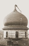 The Star of David atop the Zerrennerstrasse synagogue in Pforzheim lies bent over the cupola as a result of the burning of the synagogue on Kristallnacht.