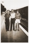 Walter Karliner (right) poses at the train station with two friends from the Hotel du Moulin youth home, before his departure.