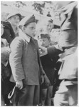 A member of the Buchenwald children's transport is greeted upon his arrival in the Ecouis children's home.
