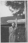 Norbert Bikales stands by a marker on the Swiss-Austrian border where he met his brother for the first time after liberation.