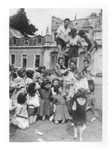 Jewish youth attempt to build a human pyramid in the yard of the Rothschild's Chateau Ferriere, where they are attending a summer camp sponsored by OSE.