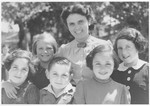 OSE relief worker, Andree Salomon, poses with a group of Jewish refugee children before their departure on a children's transport to the United States.