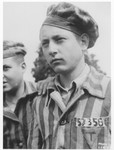 Portrait of a member of the Buchenwald children's transport wearing his camp uniform.