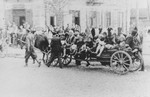 Jewish women and children are transported by horse-drawn wagon during a deportation action in the Siedlce ghetto.