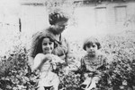 A Jewish mother poses with her three daughters in Stolin, Poland.