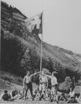 On the Swiss independence day, boys from the Hôme de la Forêt children's home pose next to a Swiss flag at the historic site where the Swiss took an oath to drive out the Austrians.