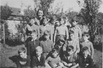 Raymonde Sauviac, a teacher at the Quincy children's home, poses with a group of Jewish refugee boys who arrived on a Kindertransport from Germany.
