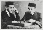 Two Hasidic youths play a game of chess.

Tadek Majranc is pictured on the right.