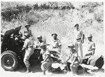 An Israeli artillery unit gathers by a howitzer during the Israeli War of Independence.