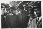 A group of religious Jewish men at a gathering in Sanok.