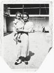 Rosa Magid holds her baby daughter, Bertha, in her arms.