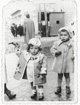 Bertha Magid and her cousin stand on a street corner in Bialystok.