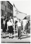 Two children pose with a Zionist flag while preparing for a demonstration in the Zeilsheim DP camp.