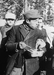 Jewish conscripts in Company 108/57 of the Hungarian Labor Service at mealtime.