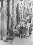 Jewish children sell soft drinks at the entrance to Mr.