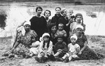Group portrait of the Magid and Eppel families in the Vilna countryside.
