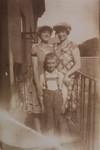 Group portrait of three Jewish cousins on a balcony in Jaroslaw, Poland.