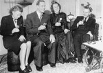 SS-Obersturmbannfuehrer Albert Konrad Gemmeker (far right) entertains guests visiting Westerbork for Christmas celebrations.