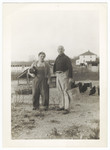 A German-Jewish refugee couple work on their chicken farm in Vineland, NJ.