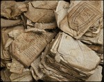 A pile of Hebrew prayerbooks and other Jewish religious texts damaged by fire at the synagogue in Bobenhausen II, District Vogelsberg, during Kristallnacht.