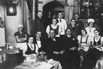 The staff of a kosher boarding home poses together in the dining room.