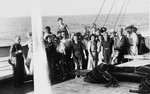Group portrait of European refugees saved by the Emergency Rescue Committee on board the Paul-Lemerle, a converted cargo ship sailing from Marseilles to Martinique.