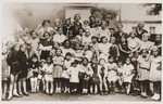 Group portrait of students in the Sadagura Beit Yaakov school dressed up in costumes to represent different Jewish holidays.