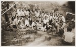 Group portrait of high school students on an outing in the countryside near Cernauti.