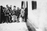 Prisoners in Rivesaltes on line for rations.