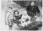 Dvorah Rubin (the donor's grandmother) poses next to a hammock with her daughter and grandchildren.