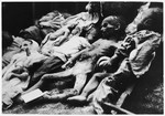 The bodies of emaciated children lying on the ground at an unidentified concentration camp for children in Croatia.