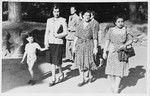Cristina Frascatani  walks down the street with a group of Jewish friends including two whom she hid during the war.