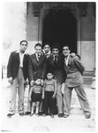 A group of young men and children stand outside the synagogue in Rome.