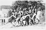 A group of female swimmers pose on the beach.

Among those pictured are: Ruth Langer (third from the right), Anna-Marie Pick (second from the right), and Judith Deutsch (sixth from the right).